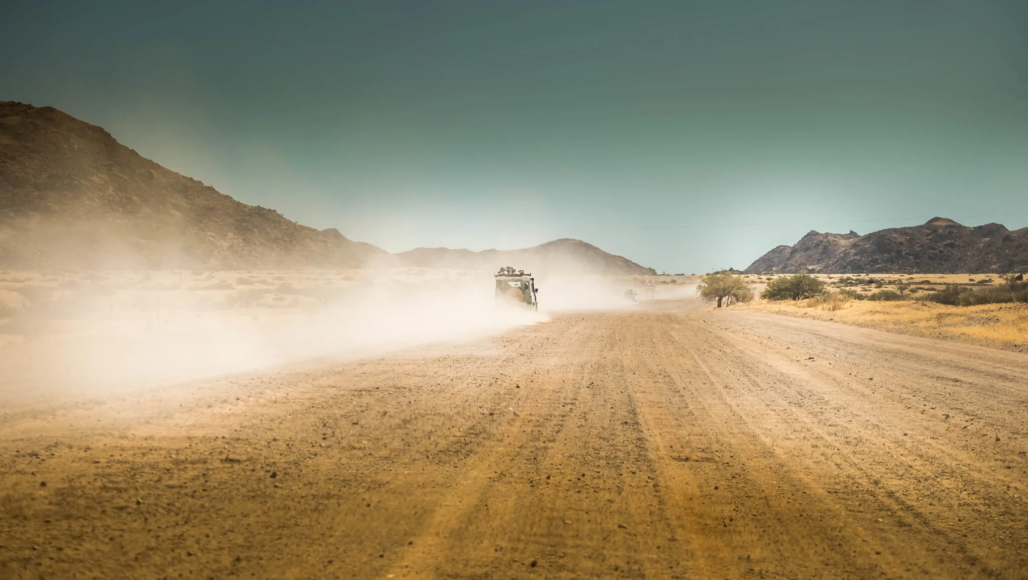 Land rover on gravel road on self-drive safari