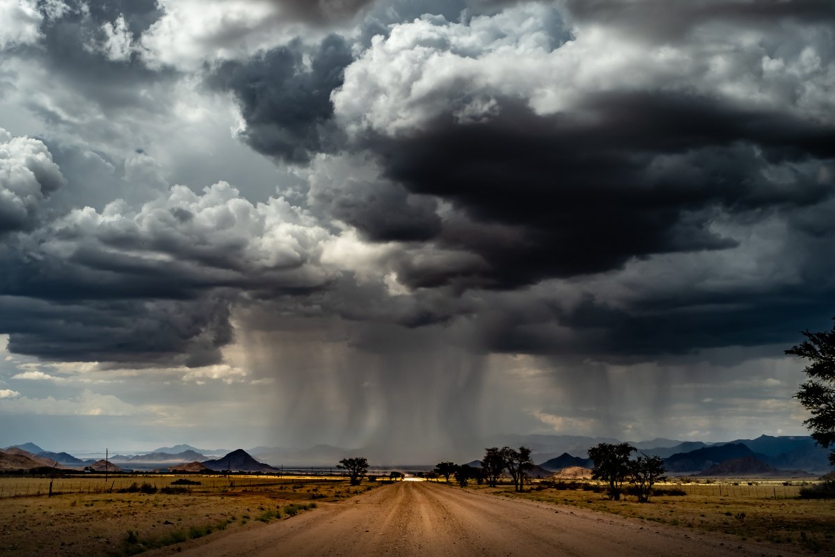 Rains and clouds in Namibia over gravel road