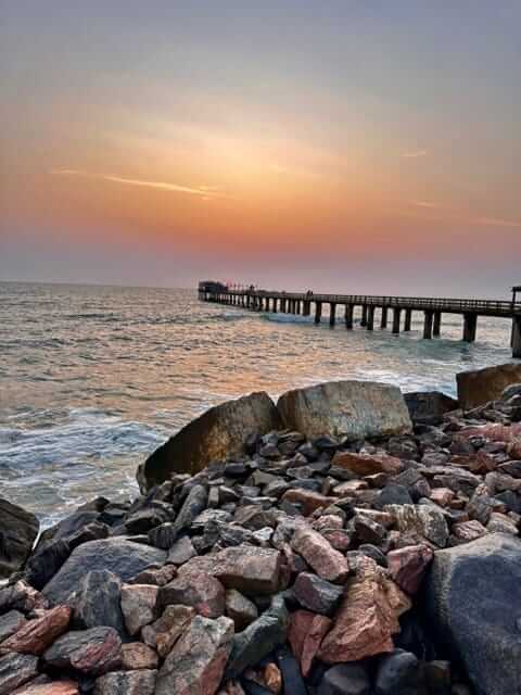 The iron jetty at Swakopmund reaching into the Atlantic from the rocky shore