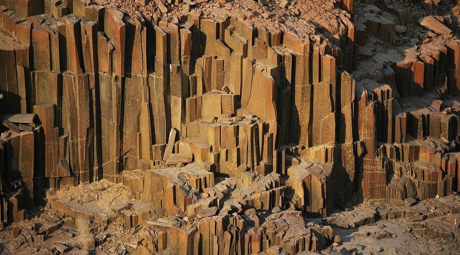 Sandstone slabs bearing prehistoric engravings in the Damaraland landscape of north-western Namibia